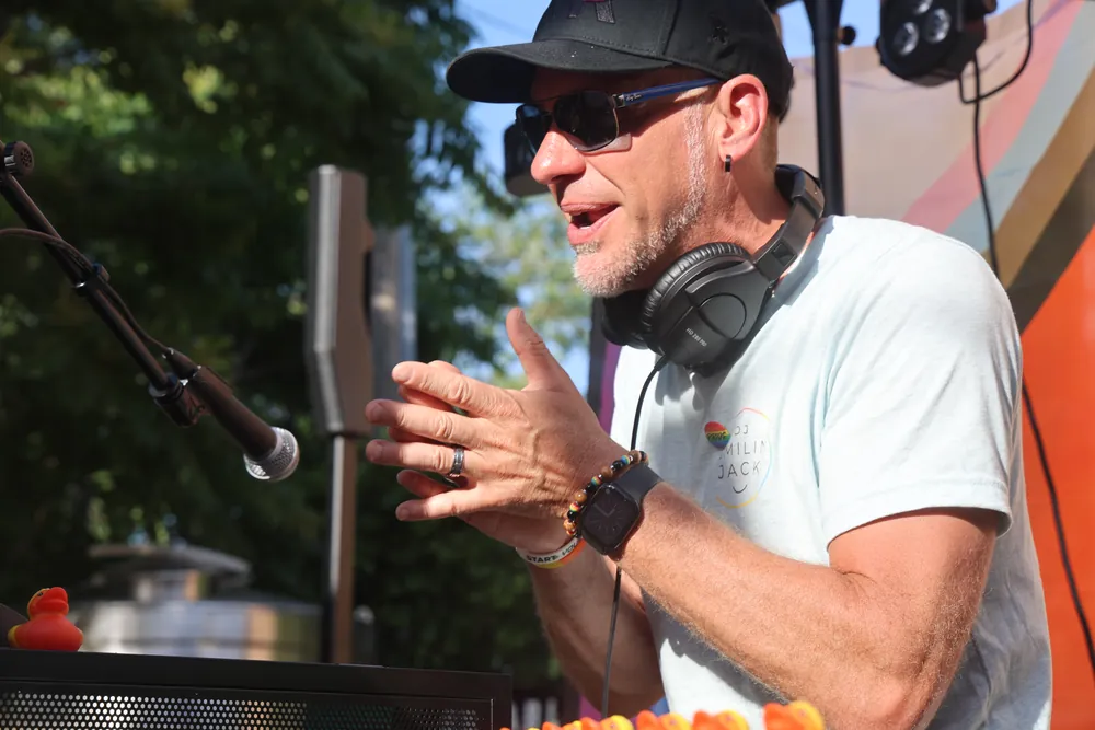 DJ Smilin' Jack animated behind the decks mid-set